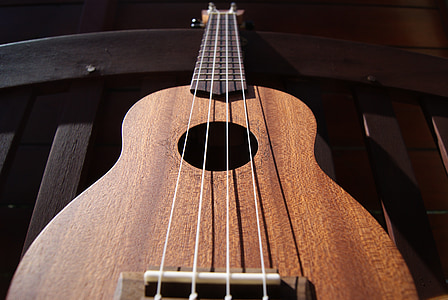 closeup photo of brown ukulele thumbnail