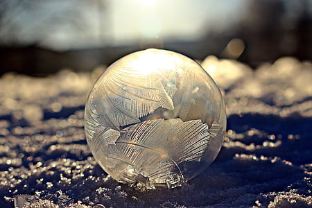 focus photo of round clear glass ball thumbnail