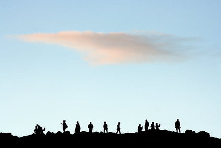 silhouette of people on top of hill thumbnail