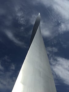 gray twisted high-rise building under cloudy sky thumbnail