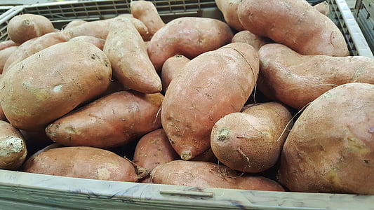 sweet potatoes on gray crates thumbnail