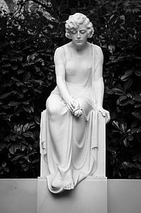 woman white statue near plants thumbnail