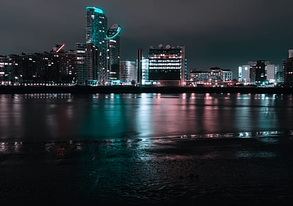 body of water near city at nighttime thumbnail