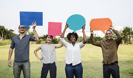 four people holding message clouds thumbnail