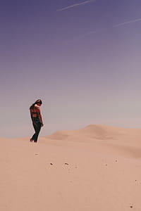 woman standing on desert thumbnail