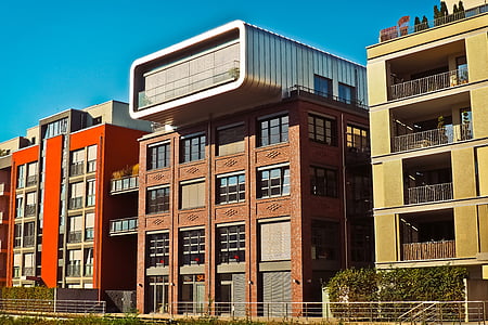 brown concrete structure between two buildings \ thumbnail