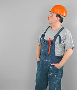 man wearing blue overalls and orange hard hat thumbnail
