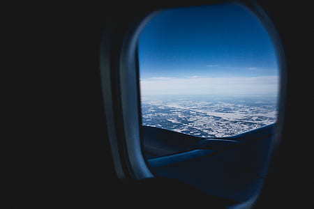 person taking photo inside airplane thumbnail