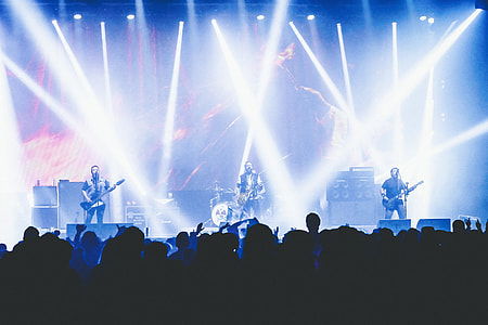 A band on stage at a music concert thumbnail