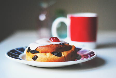 selective focus photography of baked pastry near red and white mug thumbnail