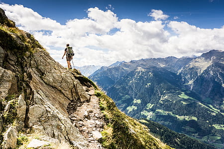 person at top of mountain thumbnail