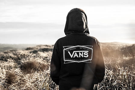Photo Of Person Wearing Black Vans Hoodie thumbnail