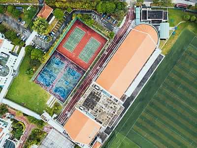 aerial view photography of house near sports field thumbnail