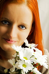 smiling woman holding bouquet of flowers thumbnail