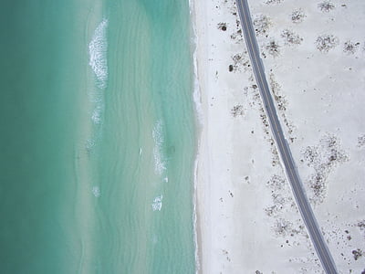 aerial photography of road beside seashore at daytime thumbnail