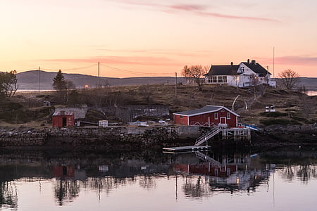 house near lake under golden hour thumbnail