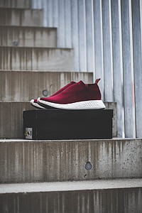 pair of red adidas runner shoes on box thumbnail