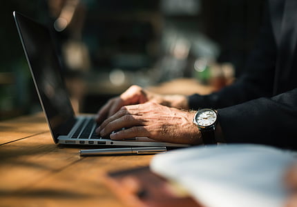 person using laptop thumbnail