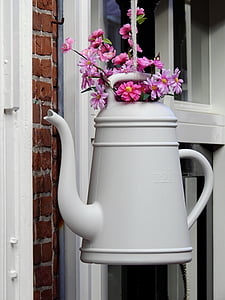 pink flowers on white watering can thumbnail