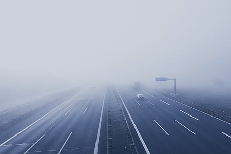 fog-covered highway during daytime thumbnail