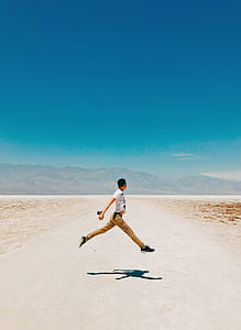 person doing hopping on mid air during daytime thumbnail