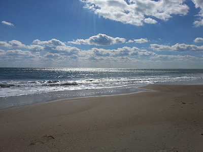 photo of beach during blue sky thumbnail