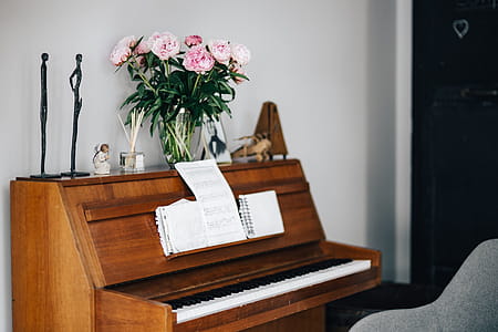 Old piano with sheet music thumbnail