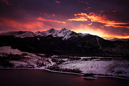 mountain covered by snow at golden hour thumbnail