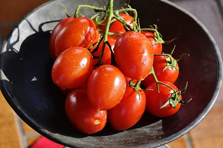 red tomatoes in black bowl thumbnail