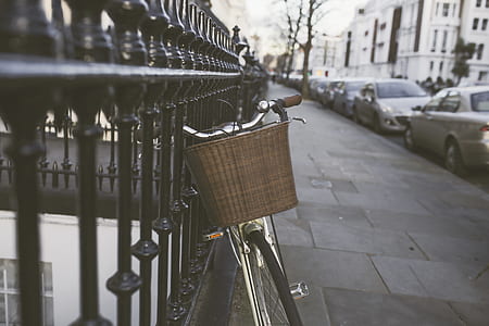 Silver Bicycle on Black Steel Fence thumbnail