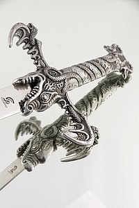 close-up photography of gray sword thumbnail