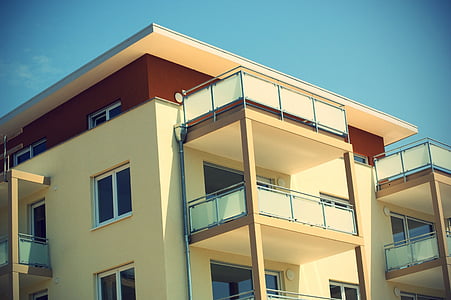 beige and brown painted concrete building under blue sky thumbnail