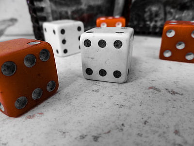red and white dices on top of white surface thumbnail