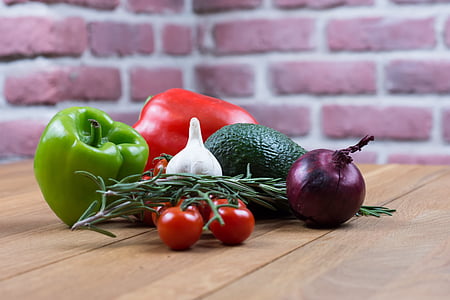 onion, garlic, tomatoes, and peppers on table thumbnail