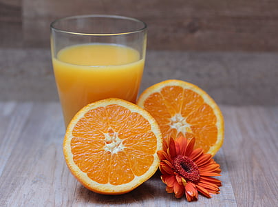 orange juice beside sliced orange fruit thumbnail
