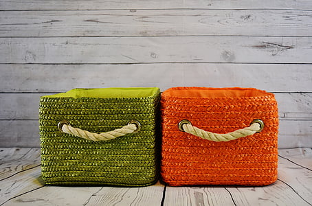 green and orange fabric hampers on gray flooring thumbnail