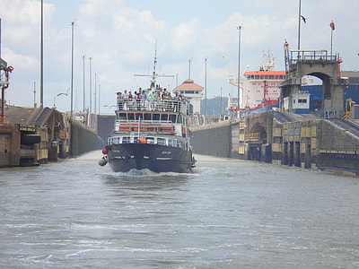black and gray motor boat at water during daytime thumbnail