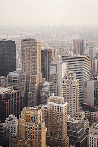 aerial view photography of high-rise building under cloudy sky thumbnail