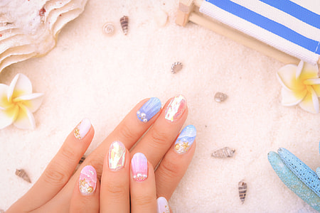 persons hand on white textile thumbnail