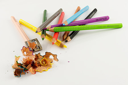 assorted-color pencils on white surface thumbnail