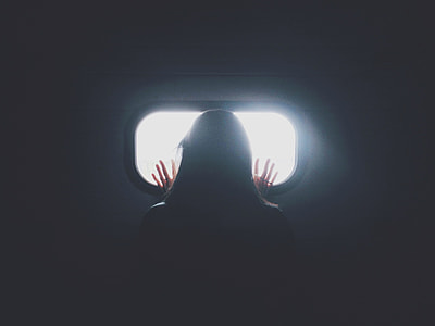 woman looking at window panel thumbnail