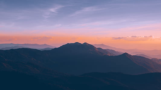 mountain view under cloudy sky at golden hour thumbnail