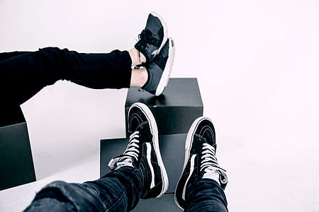 two person resting feet on black rack thumbnail