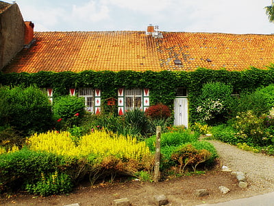 house surrounded by garden thumbnail