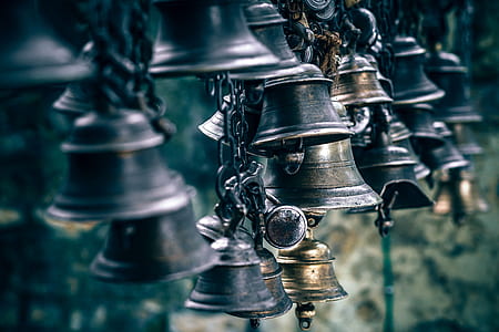 shallow focus photo of metal bell thumbnail