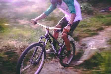 Man Riding Black and White Hardtail Mountain Bike thumbnail