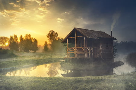 brown wooden floating hut during sunset thumbnail