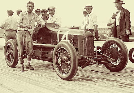 people standing beside vintage car thumbnail