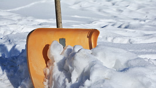 closeup photo of brown snow shovel near ice thumbnail