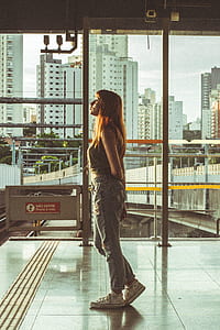 Woman Looking Through Window thumbnail